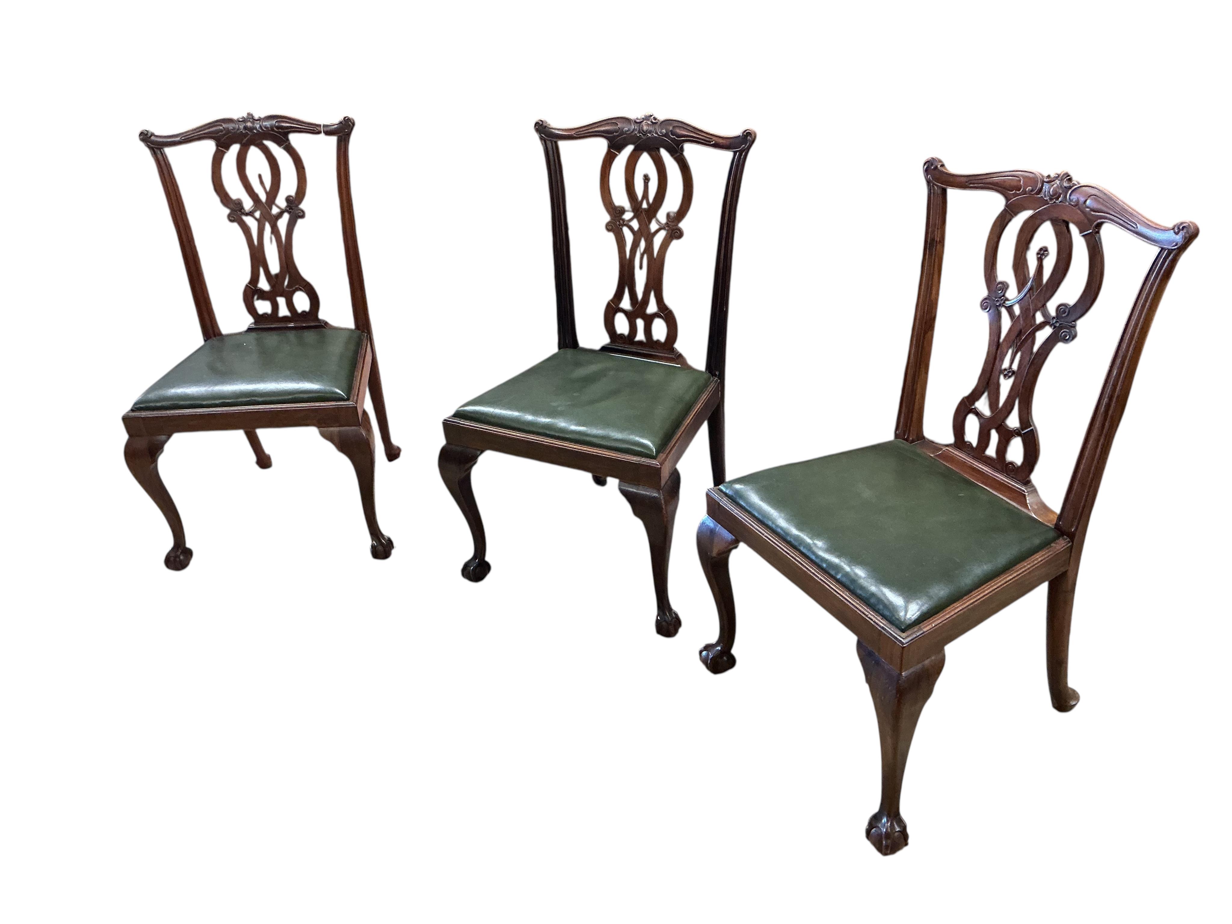 A set of nine Chippendale Revival mahogany dining chairs, two with arms